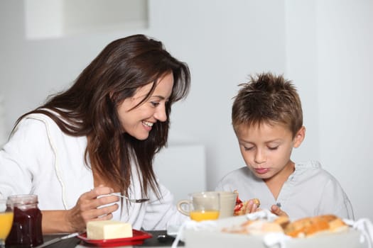 Mother and son having breakfast