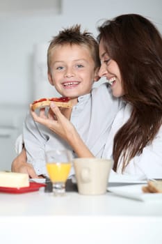 Mother and son having breakfast