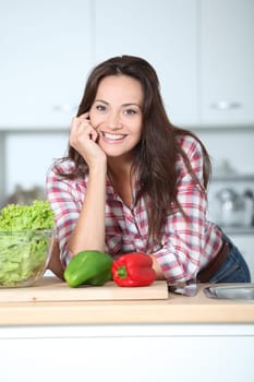 Beautiful woman stading in kitchen