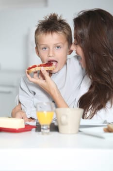 Mother and son having breakfast
