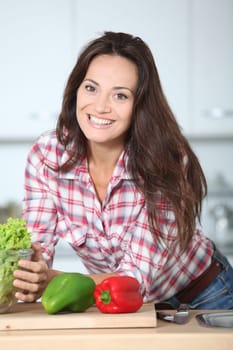 Beautiful woman stading in kitchen