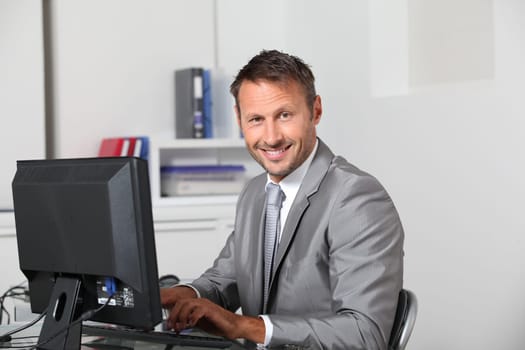 Closeup of businessman at his desk