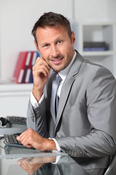 Closeup of businessman at his desk