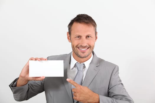 Businessman holding business card