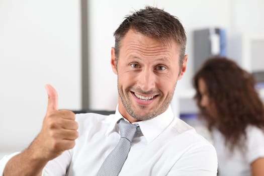 happy businessman with thumb up