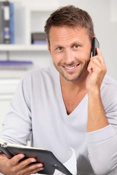 Man in the office talking on the phone