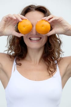 Closeup of woman eating an orange