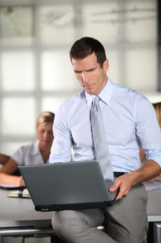 Businessman working in the office with laptop