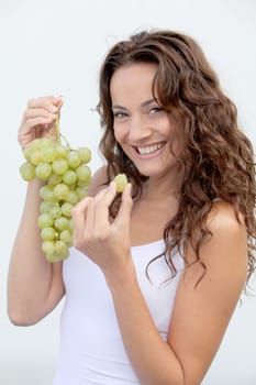 Closeup of woman eating grapes