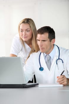 Closeup of doctor and nurse in the office