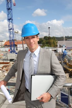 Businessman controlling site under construction