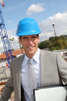 Businessman controlling site under construction