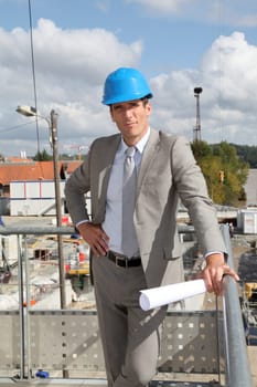 Businessman controlling site under construction