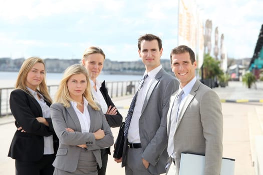 Group of business people standing outside a trade fair