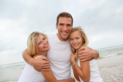 Portrait of happy family at the beach