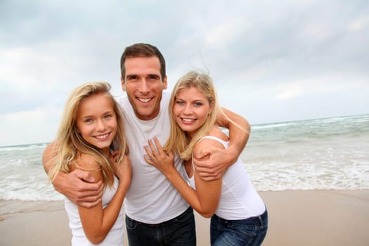 Portrait of happy family at the beach