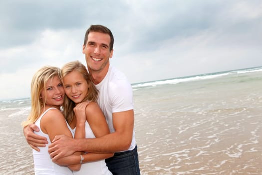 Portrait of happy family at the beach