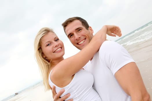 Couple having fun on a sandy beach