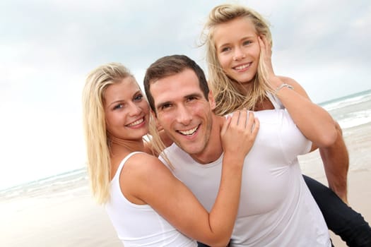 Portrait of happy family at the beach