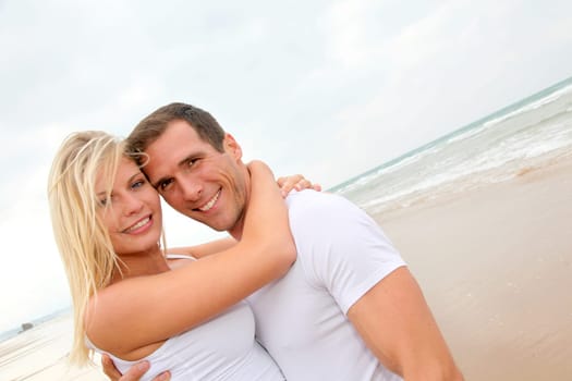 Couple having fun on a sandy beach