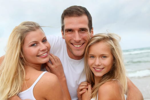 Portrait of happy family at the beach