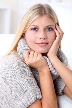 Beautiful blond woman realxing at home in winter