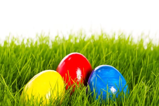 Three Easter eggs in grass