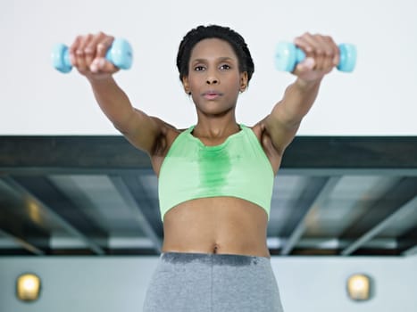 african woman exercising with weights