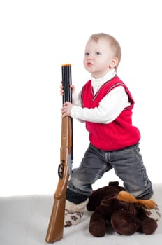 Little boy playing with gun