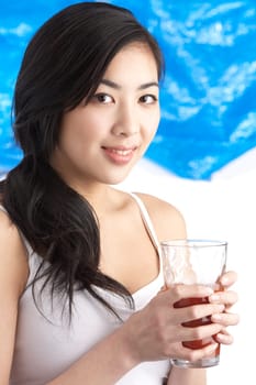 Young Woman Enjoying Healthy Drink In Studio