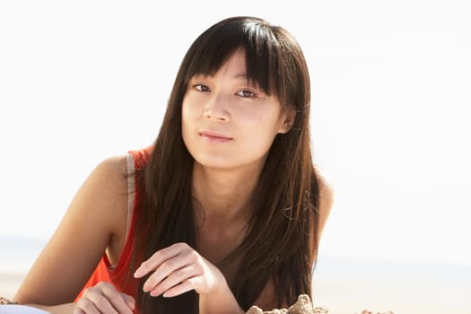 Young Woman Relaxing On Beach