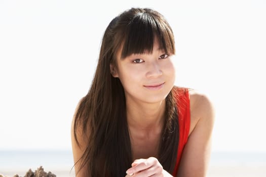 Young Woman Relaxing On Beach