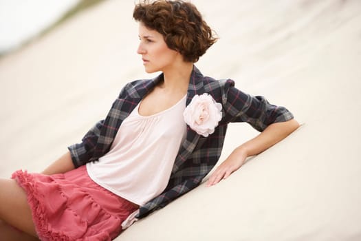 Fashionably Dressed Attractive Young Woman Standing Amongst Sand Dunes