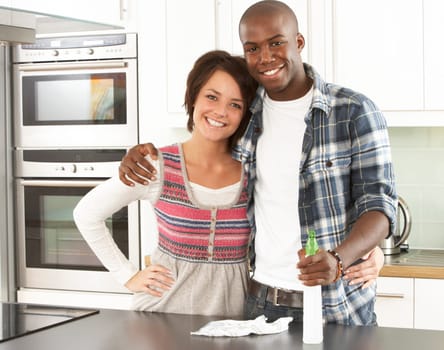 Young Couple Cleaning Cleaning Modern Kitchen