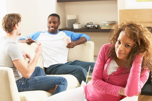 Group Of Friends Enjoying Chatting Together At Home