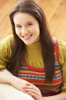 Woman Relaxing On Sofa At Home