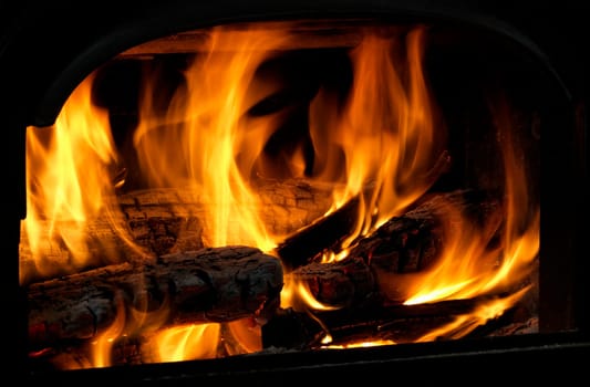 Close Up Of Flaming Logs On Fire