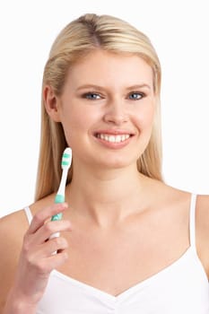 Young Woman Brushing Teeth In Studio