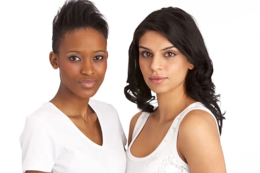 Portrait Of Two Attractive Young Women In Studio
