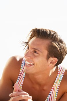Young Man Sitting On Beach