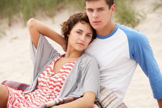 Romantic Young Couple Embracing On Beach
