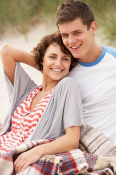 Romantic Young Couple Embracing On Beach