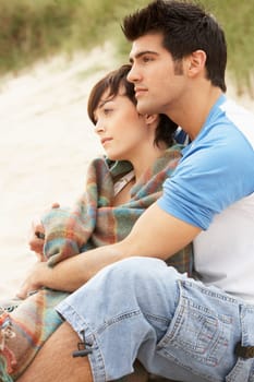 Romantic Young Couple Embracing On Beach
