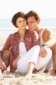 Romantic Young Couple Relaxing On Beach