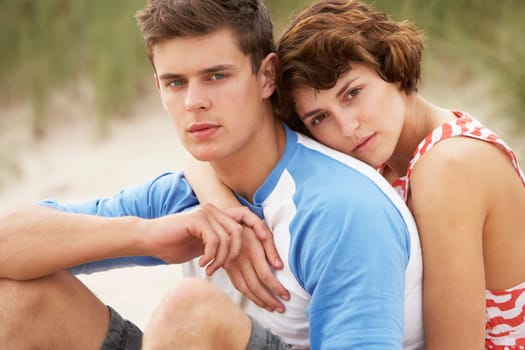 Romantic Young Couple Embracing On Beach