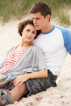 Romantic Young Couple Embracing On Beach
