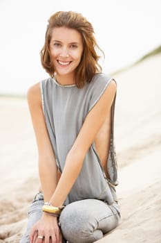 Attractive Young Woman Wearing Revealing Clothing Standing Amongst Sand Dunes