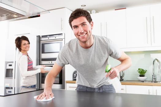 Young Couple Cleaning Cleaning Modern Kitchen