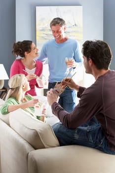 Group Of Friends Enjoying Chinese Takeaway Meal At Home