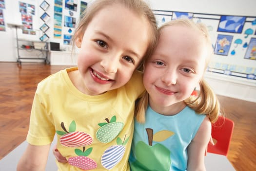 Two Female Primary Schoolchildren In Classroom